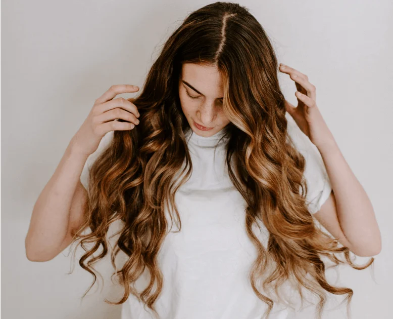 Girl with long wavy hair extensions