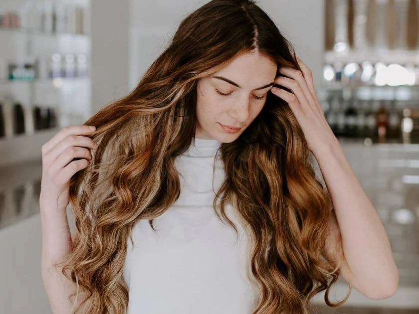 Girl with long wavy hair extensions