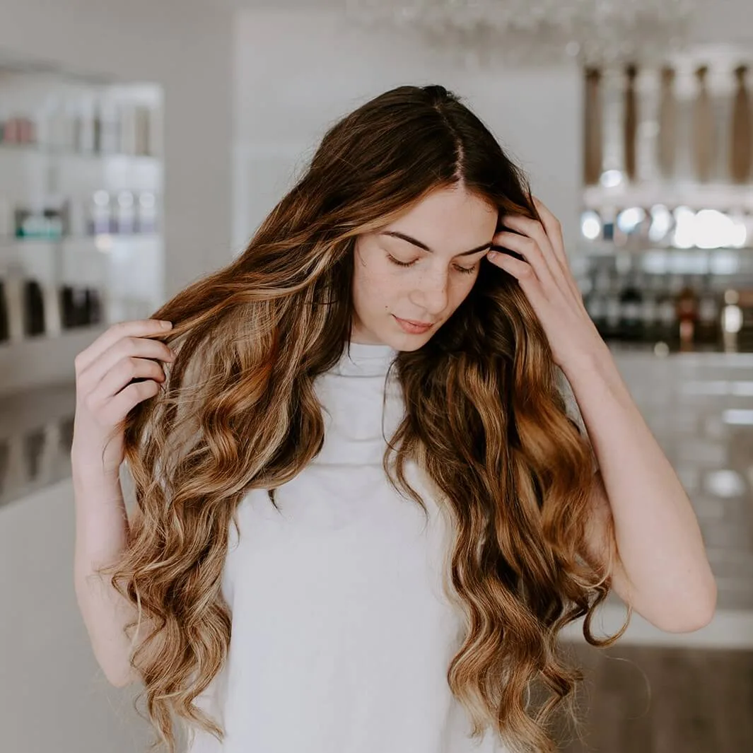 Girl with long wavy hair extensions