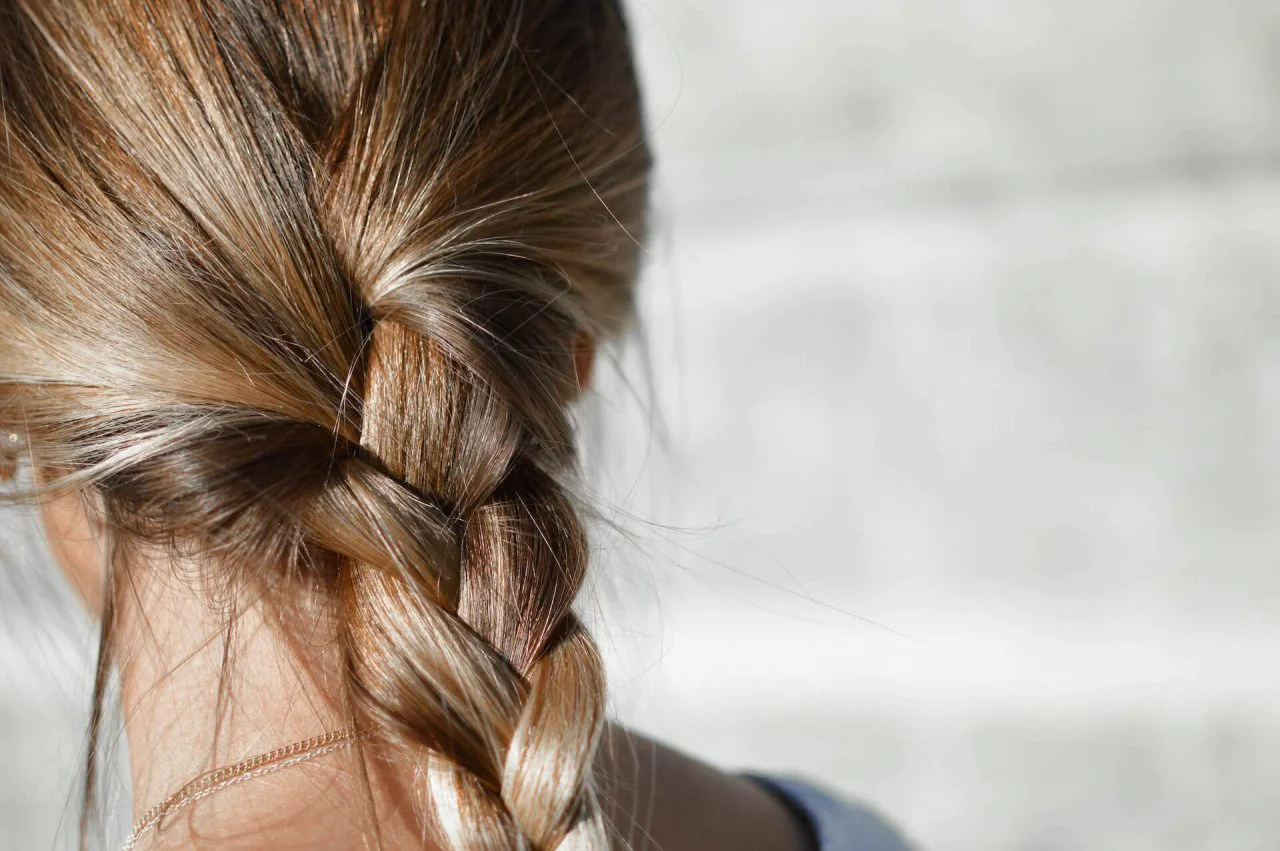 Blonde woman with low braid