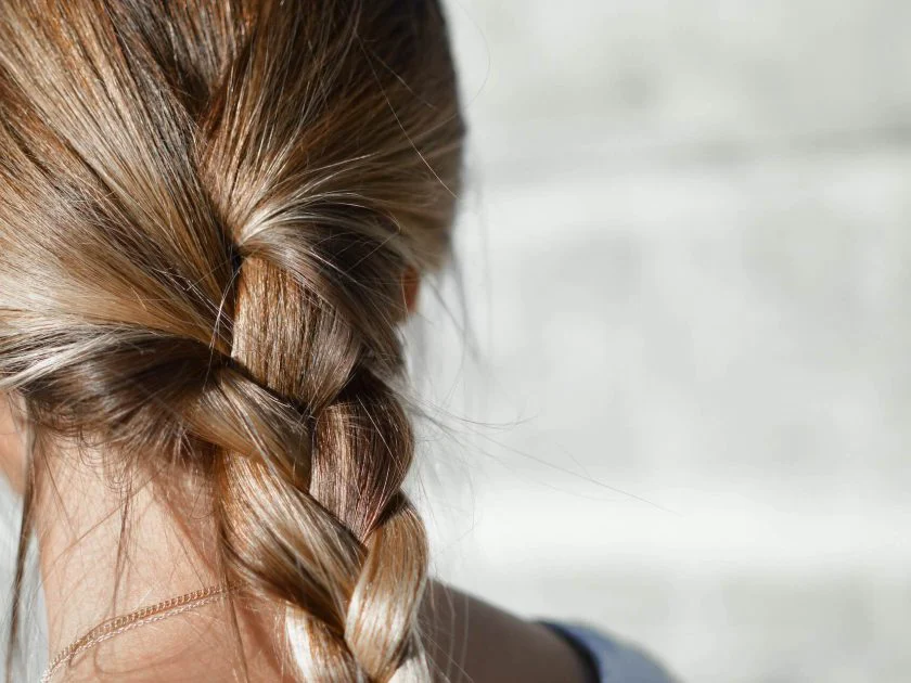 Blonde woman with low braid
