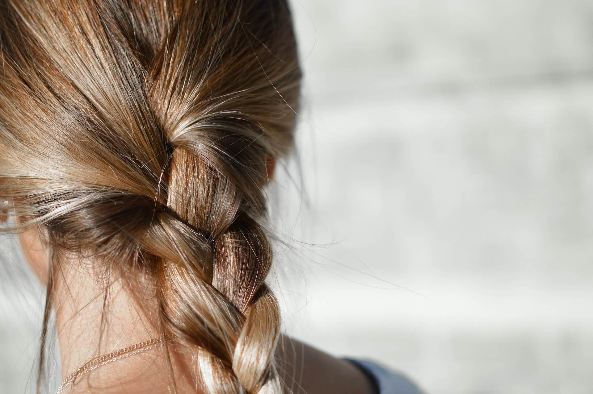 Blonde woman with low braid